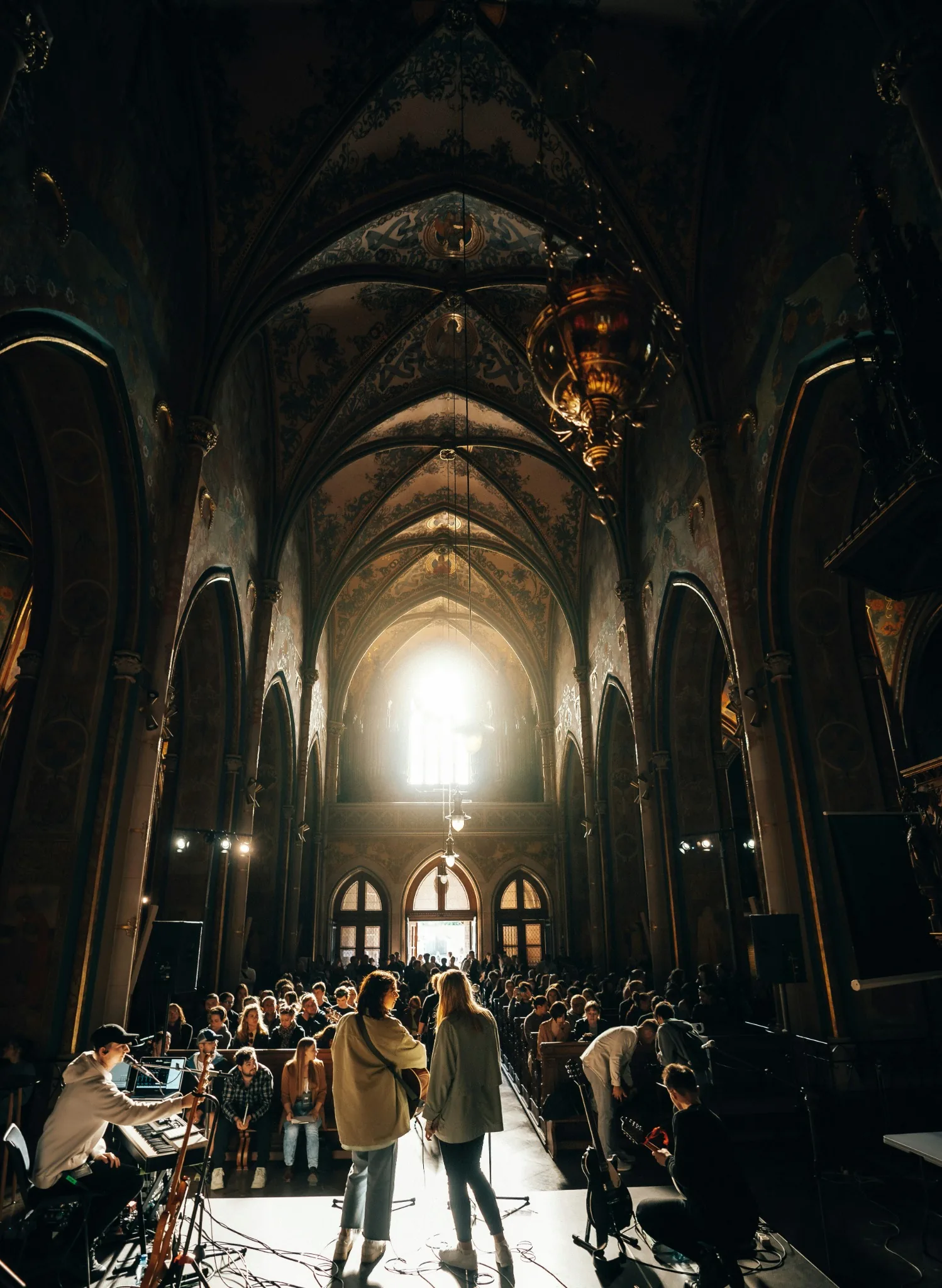 A congregation gathered inside a historic church building
